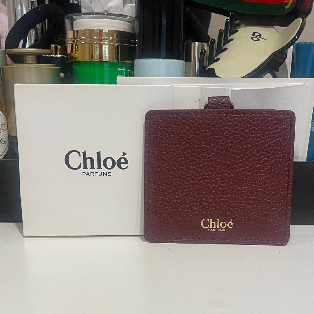 New in box Chloé Burgundy Leather mirror with case